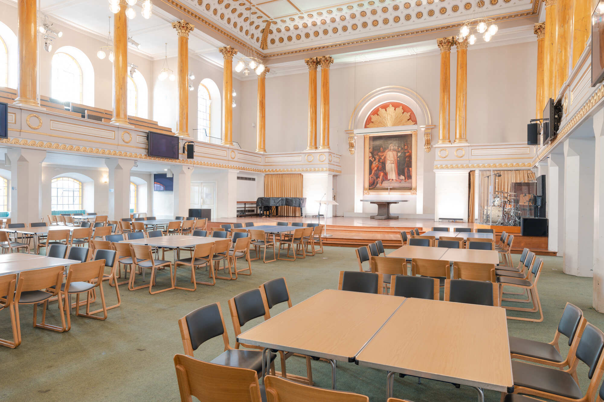 The church hall at All Souls Langham Place, set up with tables and chairs.