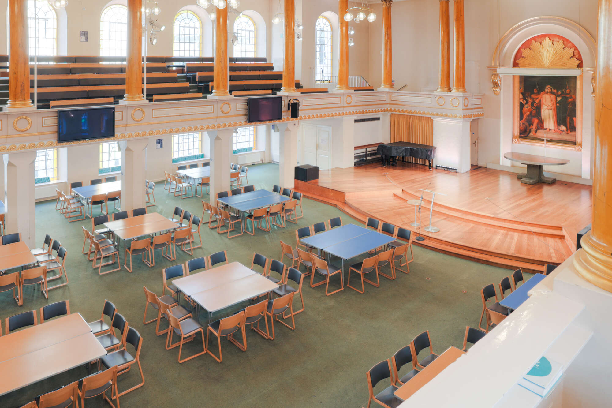The church hall at All Souls Langham Place, set up with tables and chairs.