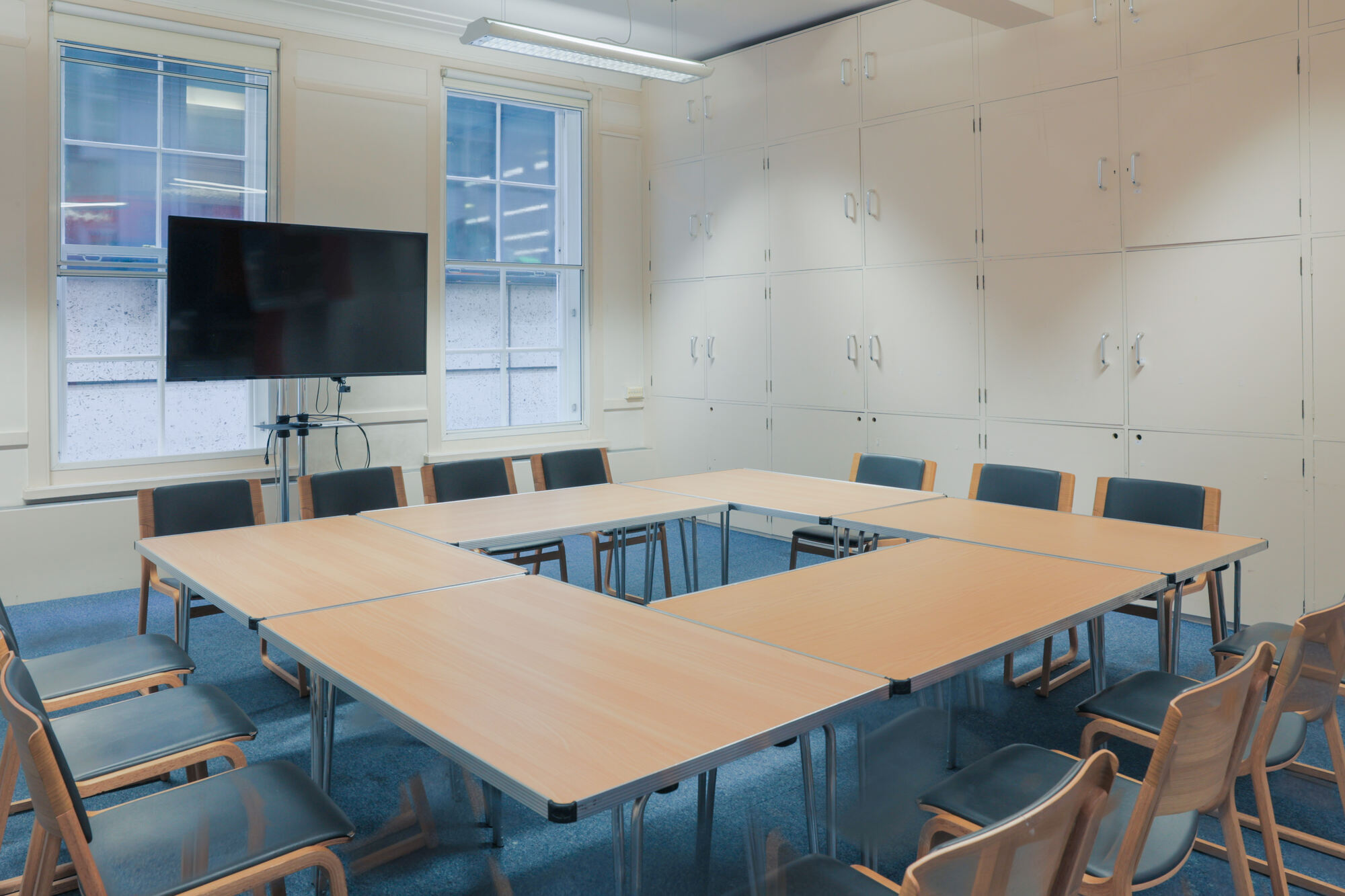 The Langham Room at All Souls Langham Place, set up with tables and chairs.