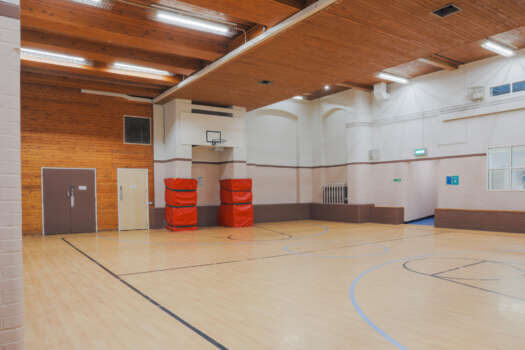 The gym at All Souls Clubhouse, set up as an empty room.