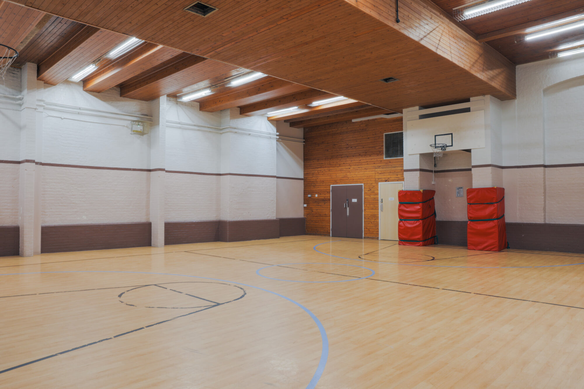 The gym at All Souls Clubhouse, set up as an empty room.