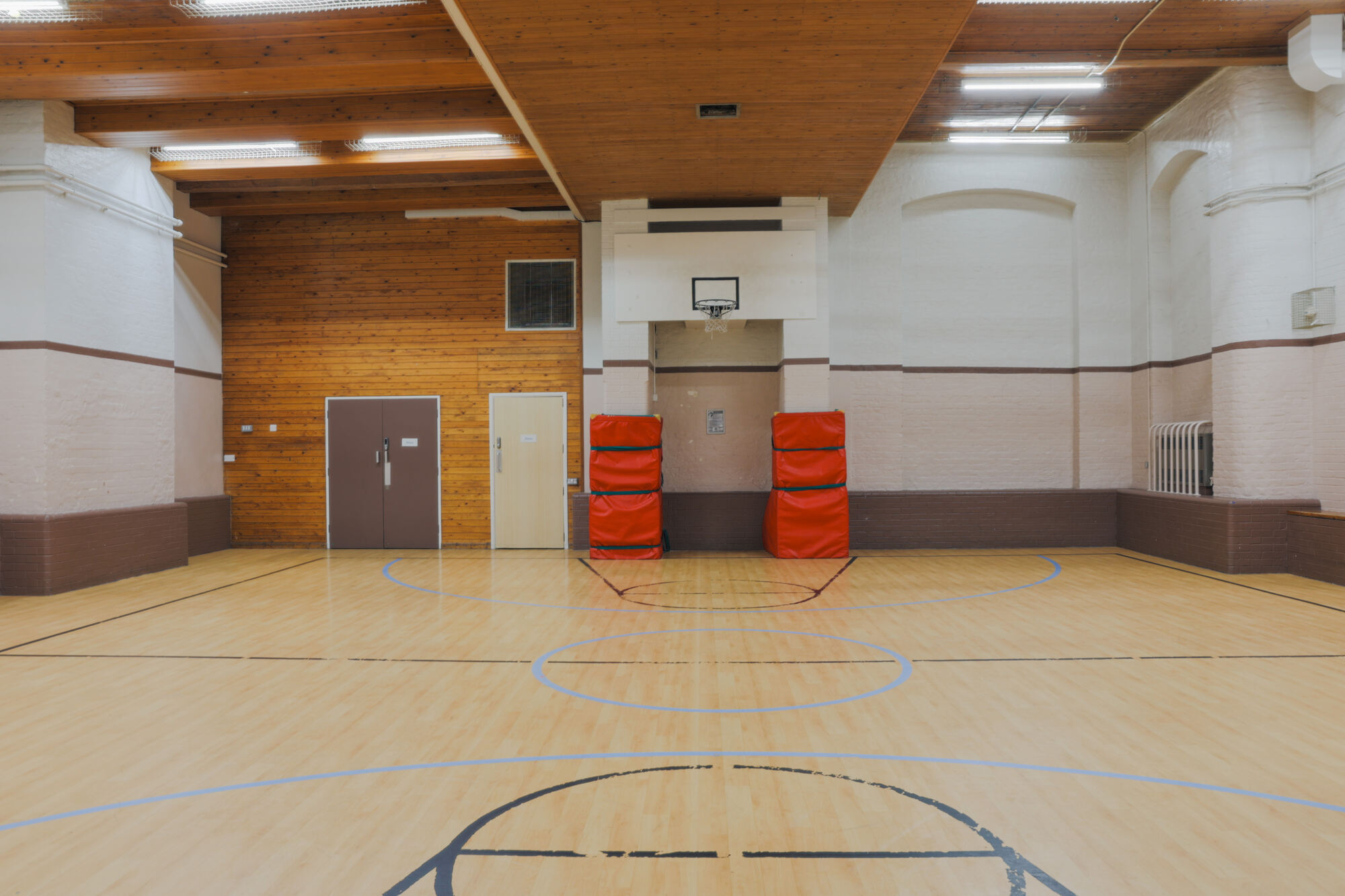 The gym at All Souls Clubhouse, set up as an empty room.