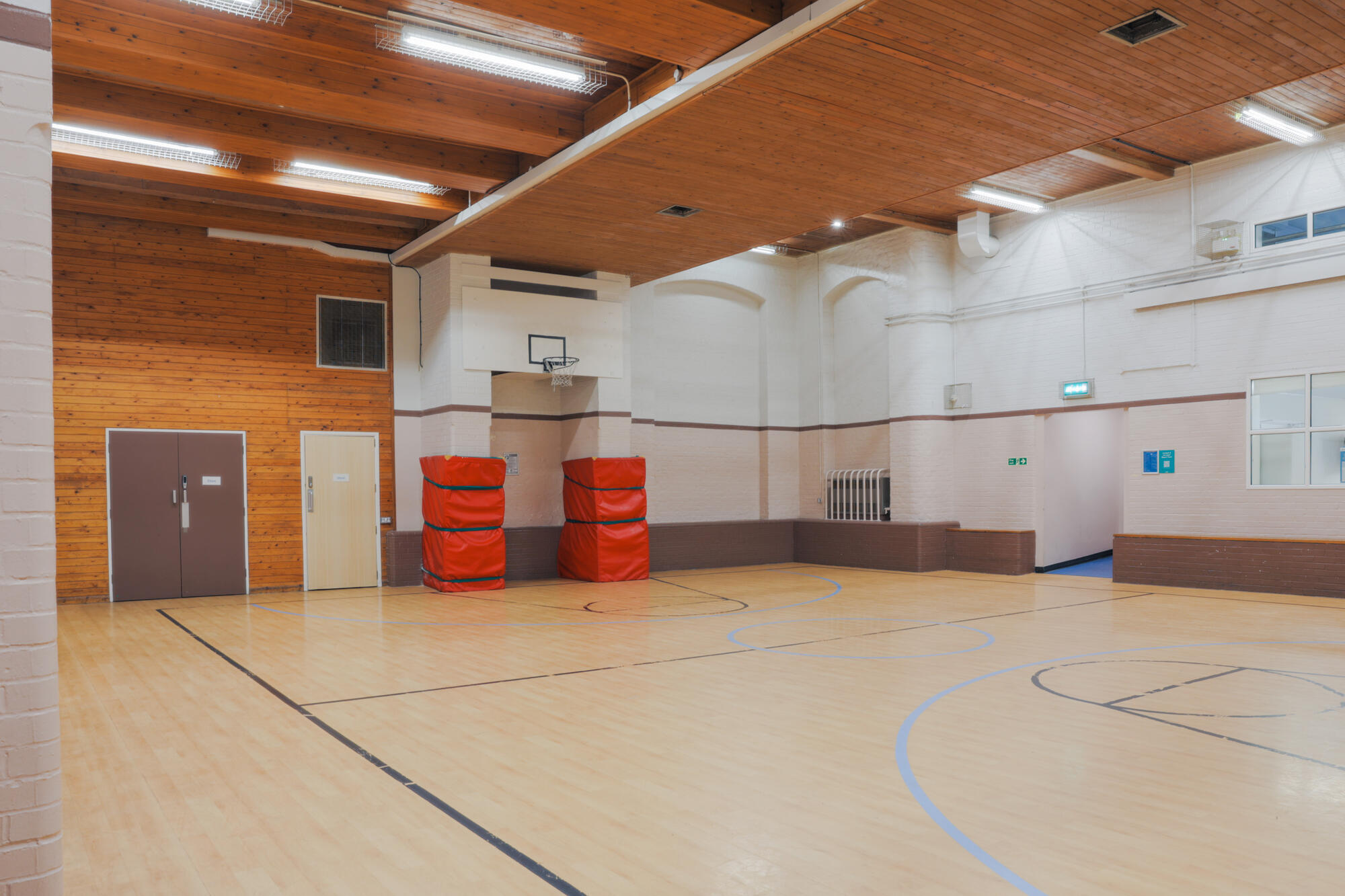 The gym at All Souls Clubhouse, set up as an empty room.