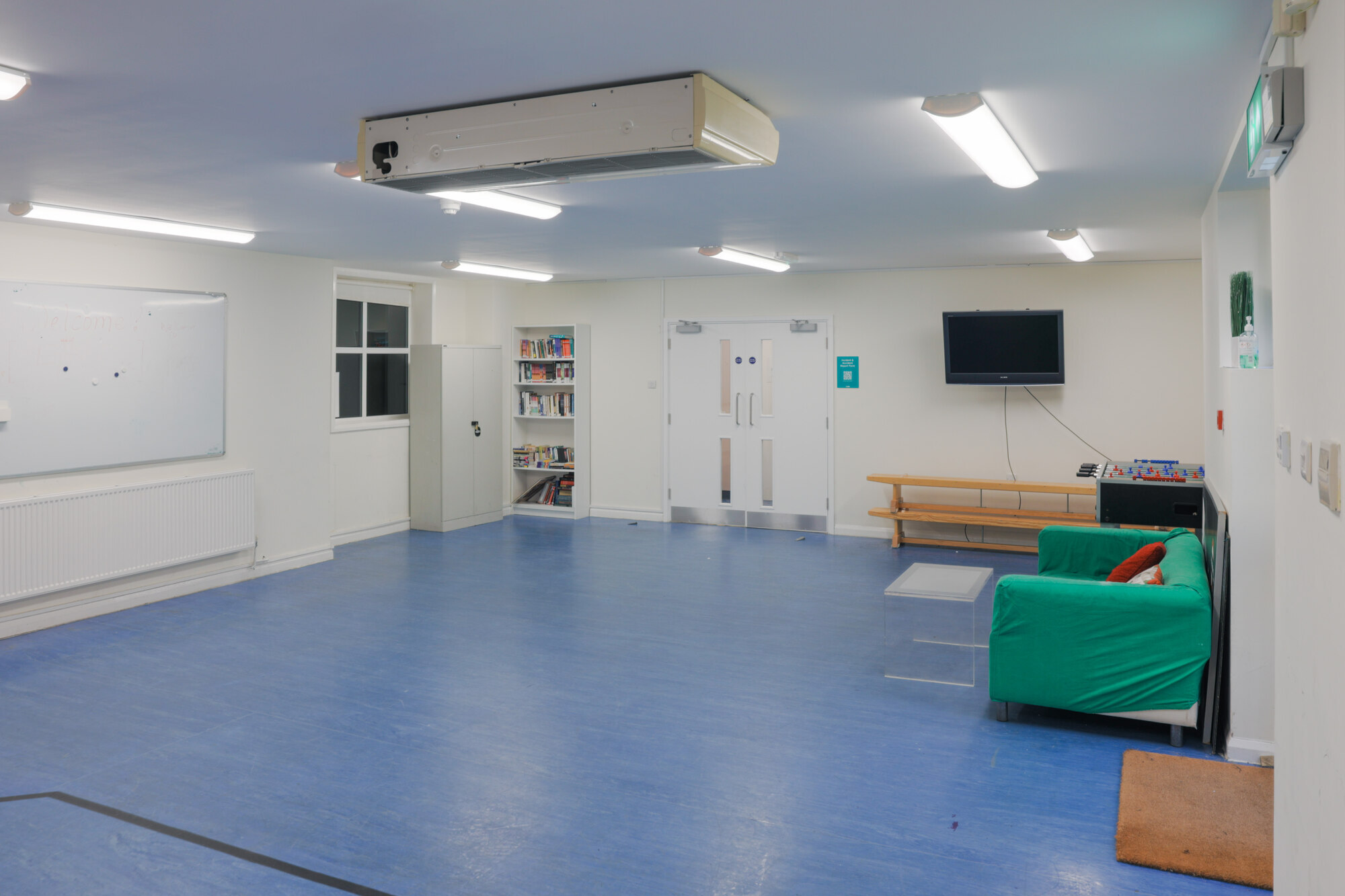 The Greenwell Room at All Souls Clubhouse, set up as an empty room.