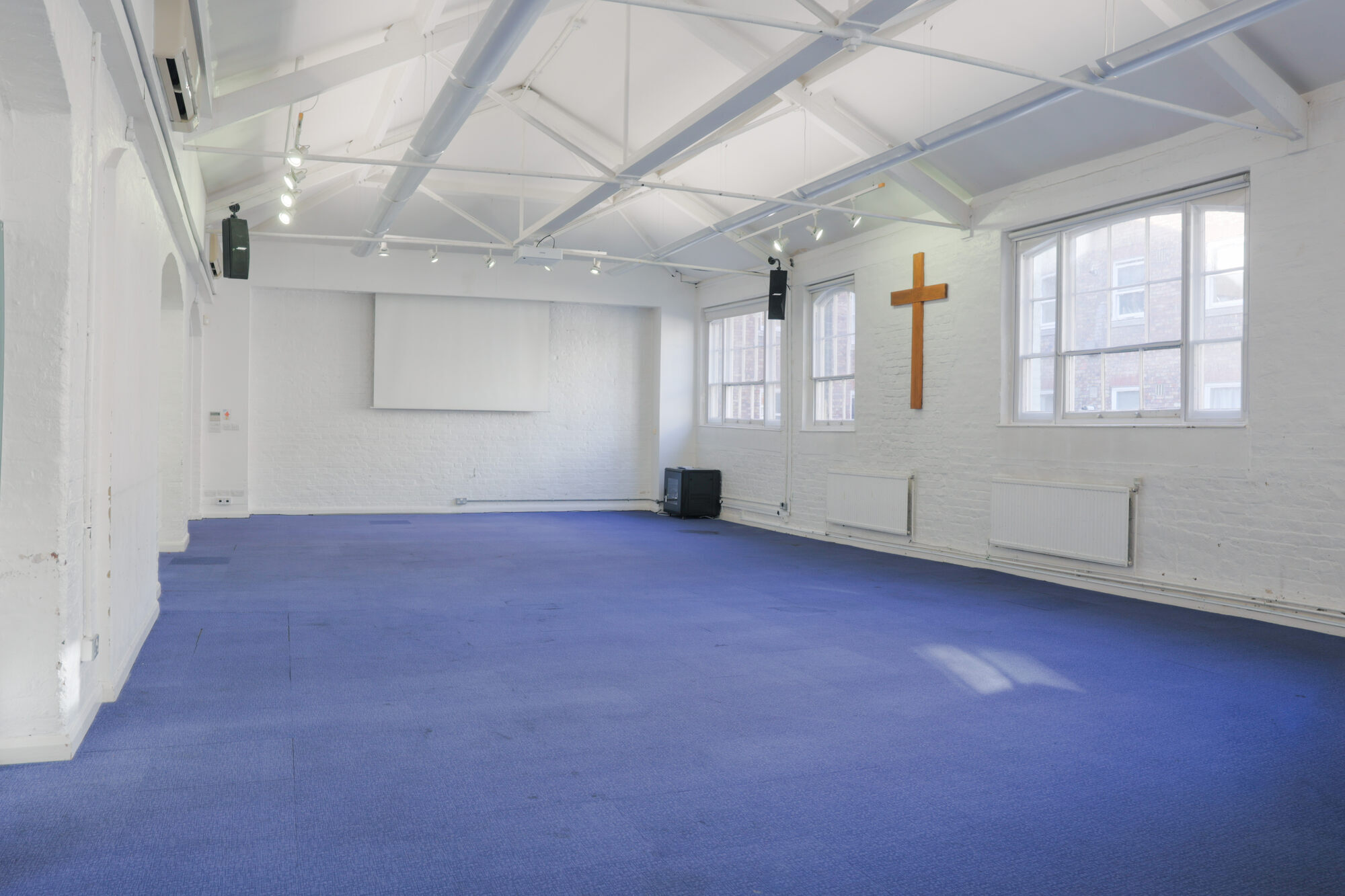 The Upper Room at All Souls Clubhouse, set up as an empty room.